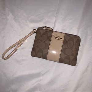 Coach cream/tan wristlet.